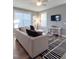 Bright living room featuring a comfortable sofa, contemporary rug, and a cozy atmosphere at 103 1St St, Haw River, NC 27258