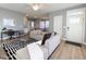 Spacious living room with contemporary furniture, leading to the kitchen and dining areas at 103 1St St, Haw River, NC 27258