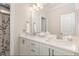 Bathroom featuring double sinks, granite countertops, and shower with floral curtain at 123 Stone Park Dr, Wake Forest, NC 27587