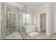 Modern bathroom with glass enclosed shower, soaking tub and tiled floors at 123 Stone Park Dr, Wake Forest, NC 27587