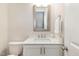 Modern bathroom featuring white shaker cabinets, quartz countertop and a framed mirror at 123 Stone Park Dr, Wake Forest, NC 27587