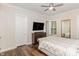 Spacious bedroom with hardwood floors, a ceiling fan, and large windows for ample natural light at 123 Stone Park Dr, Wake Forest, NC 27587