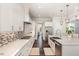 Modern kitchen featuring white cabinetry, stainless steel appliances, and a mosaic tile backsplash at 123 Stone Park Dr, Wake Forest, NC 27587
