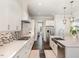 Modern kitchen featuring white cabinetry, stainless steel appliances, and a mosaic tile backsplash at 123 Stone Park Dr, Wake Forest, NC 27587