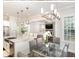 Bright, open kitchen and dining area with stainless appliances and large center island at 123 Stone Park Dr, Wake Forest, NC 27587