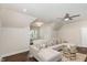 Spacious living room with vaulted ceilings, a comfortable couch, and wood floors at 123 Stone Park Dr, Wake Forest, NC 27587