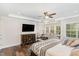 Spacious main bedroom features a trey ceiling, sitting area, and large windows at 123 Stone Park Dr, Wake Forest, NC 27587