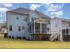 Charming home featuring a screened-in porch, deck, and manicured lawn, perfect for outdoor living at 123 Stone Park Dr, Wake Forest, NC 27587