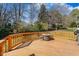 Inviting backyard deck with a cozy seating area around a gas fire pit at 12409 Village Gate Way, Raleigh, NC 27614