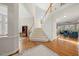 Elegant foyer with hardwood floors, staircase, and open view to living spaces at 12409 Village Gate Way, Raleigh, NC 27614