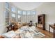 Sun-filled living room with large bay windows and hardwood floors at 12409 Village Gate Way, Raleigh, NC 27614