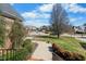 Scenic view of a quiet neighborhood with well-maintained homes and lush landscaping at 12409 Village Gate Way, Raleigh, NC 27614