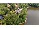 Expansive aerial view showcasing the home's proximity to the lake and surrounding landscape at 1315 Sagamore Dr, Louisburg, NC 27549