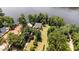 Aerial shot of house surrounded by lush trees with waterfront access at 1315 Sagamore Dr, Louisburg, NC 27549