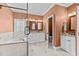 Bright bathroom featuring a separate shower and tub, dual sinks, and modern finishes at 1315 Sagamore Dr, Louisburg, NC 27549