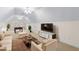 Large bonus room with beige walls, plush seating, a flat screen TV, and a billiards table at 1315 Sagamore Dr, Louisburg, NC 27549
