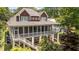 Exterior of two-story house featuring large screened porch at 1315 Sagamore Dr, Louisburg, NC 27549