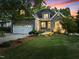 Charming stone home with a well-manicured lawn and attached garage, perfect for a Gathering seeking comfort and style at 1315 Sagamore Dr, Louisburg, NC 27549