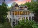 Beautiful waterfront home with spacious screened porch and ample space for outdoor entertaining and relaxation at 1315 Sagamore Dr, Louisburg, NC 27549