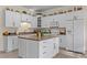 Well-equipped kitchen with white cabinets, an island, and modern appliances at 1315 Sagamore Dr, Louisburg, NC 27549