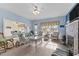 Comfortable living room boasts a fireplace, white wicker furniture, and tranquil blue walls at 1315 Sagamore Dr, Louisburg, NC 27549