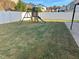 Spacious backyard featuring a wooden playset, perfect for outdoor fun at 141 W Falcon Ct., Clayton, NC 27520