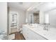 Elegant bathroom features double vanities, a walk-in shower, and ample storage space at 141 W Falcon Ct., Clayton, NC 27520