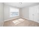 Bright bedroom with a closet and large window at 141 W Falcon Ct., Clayton, NC 27520