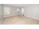 Spacious bedroom has soft carpet, great natural light, and a walk-in closet at 141 W Falcon Ct., Clayton, NC 27520