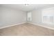 This is a bedroom with two windows that lets in natural light at 141 W Falcon Ct., Clayton, NC 27520