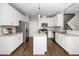 Modern kitchen boasts stainless steel appliances, granite countertops, and a stylish center island at 141 W Falcon Ct., Clayton, NC 27520