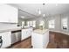 Bright kitchen features stainless appliances, granite counters, an island, and an open layout at 141 W Falcon Ct., Clayton, NC 27520