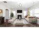 Cozy living room with a fireplace, soft neutral colors, plush seating, and lots of natural light at 141 W Falcon Ct., Clayton, NC 27520