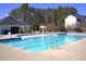 Community pool showcasing sparkling water and ample seating areas at 141 W Falcon Ct., Clayton, NC 27520