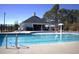 Bright community pool area with lifeguard station and surrounding greenery at 141 W Falcon Ct., Clayton, NC 27520