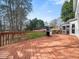Large wood back deck with gas grill that offers a view of the yard at 1716 Turtle Ridge Way, Raleigh, NC 27614