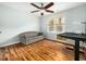Home office area or bedroom with wood floors, a ceiling fan, and ample light from a large window at 1716 Turtle Ridge Way, Raleigh, NC 27614