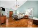 Spacious bedroom featuring wood floors, a ceiling fan, and lots of natural light from the windows at 1716 Turtle Ridge Way, Raleigh, NC 27614