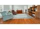 Comfortable living room with hardwood floors, decorative rug, and plenty of natural light at 1716 Turtle Ridge Way, Raleigh, NC 27614