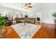 Spacious living room with hardwood floors, large sofa and many windows for natural light at 1716 Turtle Ridge Way, Raleigh, NC 27614