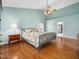 Spacious main bedroom with hardwood floors, a ceiling fan, and a walk-in closet at 1716 Turtle Ridge Way, Raleigh, NC 27614