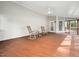 Relaxing screened porch with rocking chairs, ceiling fan, and access to the backyard at 1716 Turtle Ridge Way, Raleigh, NC 27614