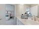 Well-lit bathroom featuring double sinks, and modern fixtures at 201 Hiddenite Pl, Holly Springs, NC 27540