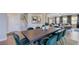 Open concept dining and living area with stairs leading to the second floor at 201 Hiddenite Pl, Holly Springs, NC 27540