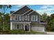 Charming two-story home with stone accents, a two-car garage, and a beautifully landscaped front yard at 201 Hiddenite Pl, Holly Springs, NC 27540