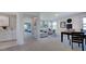 Cozy living room adjacent to the laundry and bedroom showcasing modern decor and comfortable seating at 201 Hiddenite Pl, Holly Springs, NC 27540