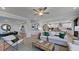 Open concept living area showcases modern furnishings and seamlessly connects with the dining area and kitchen at 201 Hiddenite Pl, Holly Springs, NC 27540