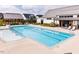Inviting pool with clear water and a relaxing seating area, ideal for enjoying sunny days and community gatherings at 201 Hiddenite Pl, Holly Springs, NC 27540