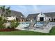 Poolside view with lounge chairs and lush greenery, offering a tranquil escape for relaxation and enjoyment at 201 Hiddenite Pl, Holly Springs, NC 27540