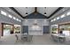 Relaxing pool pavilion with ceiling fan and a prep station for entertaining guests and enjoying the community pool at 201 Hiddenite Pl, Holly Springs, NC 27540